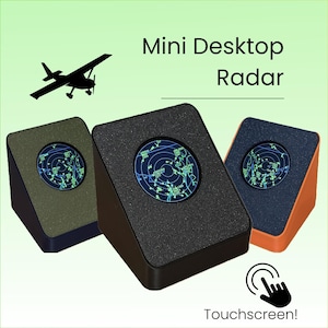 May include: Three Mini Desktop Radar units with black, olive green, and orange angled housings. Each device features a circular screen displaying a digital radar map with green data points. Text reads Mini Desktop Radar and Touchscreen!