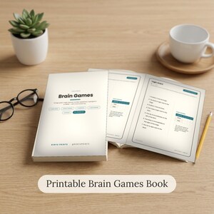 May include: A printable brain games book with a white cover featuring the text Brain Games, Rinyu Prints, and @rinyuprints. The open book displays logic grid puzzles, text, and tables. Black glasses and a yellow pencil lie nearby.