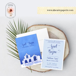 Pode incluir: Um convite de casamento azul e branco com uma ilustra&ccedil;&atilde;o em aquarela de uma igreja branca com detalhes azuis. O convite diz "April & Bryan na bela ilha de Santorini, Gr&eacute;cia 20 de maio de 2025 &agrave;s 17h00 La Lil Santorini Imerovigli Santorini"
