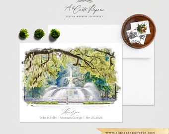 May include: A watercolor illustration of a fountain in a park with a large oak tree with Spanish moss hanging from its branches. The text "Thank you" is written in cursive below the image. The text "Taylor & Collin | Savannah, Georgia | May 23 2024" is written below the cursive text.