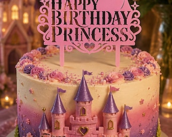 May include: A pink cake topper featuring a silhouette of a princess and a castle with the text HAPPY BIRTHDAY PRINCESS, positioned atop a round cake decorated with a miniature pink and purple castle, floral accents, and a gradient frosting finish.