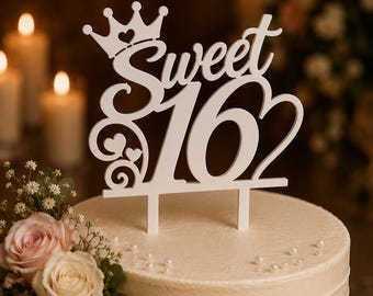 May include: A white cake topper featuring the text Sweet 16 in a cursive and bold font. The design includes a crown icon above the word Sweet, a heart shape integrated into the number 16, and decorative swirls with small hearts on the left side.