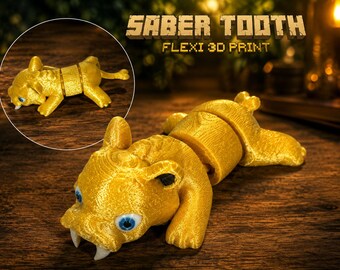May include: A gold-colored 3D printed articulated saber-tooth tiger figure with blue eyes and white fangs. The text SABER TOOTH FLEXI 3D PRINT is visible at the top. The figure features a segmented body design allowing for flexible movement.