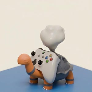 May include: A turtle-shaped desk accessory with an orange head and legs, a gray shell, and a white cloud-like protrusion. It holds a white game controller on its back. Text at the bottom reads: DESK PLANTER, UNIVERSAL CONTROLLER GRIP, ARTISANAL DESK ACCESSORY.