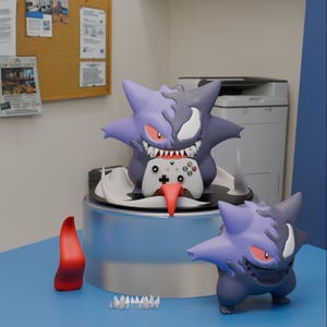 May include: A purple and dark grey Gengar-inspired figure with a split face design, sharp teeth, and red eyes, holding a white Xbox controller with a long red tongue. A smaller matching figure stands nearby with a separate red tongue and teeth.