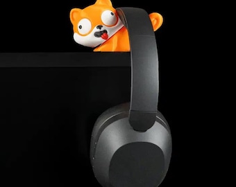 Soporte para auriculares con forma de perro pintado a mano: un accesorio de escritorio con forma de animal original.