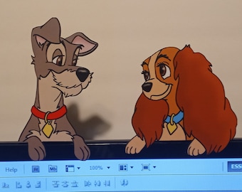 May include: A cartoon illustration of Lady and the Tramp, two dogs, looking at each other. Lady is a brown and white cocker spaniel with a blue collar. Tramp is a brown and white mixed breed dog with a red collar. The illustration is on a computer screen.