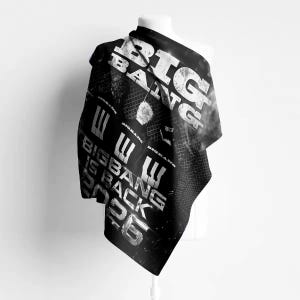 May include: A black and white fabric banner featuring the text BIG BANG at the top, a central graphic of a person with light hair, and the text BIGBANG IS BACK 2026 at the bottom. The design includes a grid pattern and distressed typography.