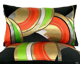 Luxury bolster pillow statement cushion made from rare vintage Japanese Obi silk bold geometric rainbow wave woven in gold red grey & green