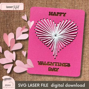 May include: A pink card with a white stitched heart design. The card says "Happy Valentines Day" in a brown font.