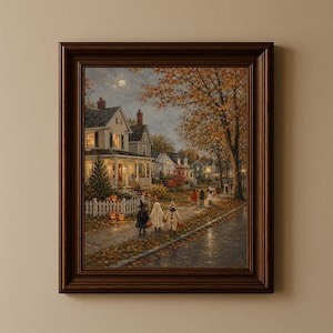 May include: A framed painting depicting a neighbourhood street scene at dusk during autumn. Children in costumes walk along a pavement lined with fallen leaves, past houses with glowing windows, a white picket fence, and illuminated jack-o'-lanterns.