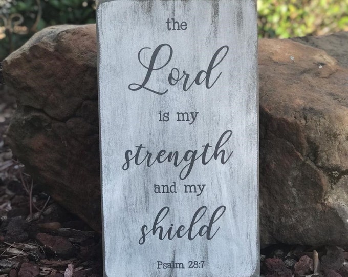 The Lord is my strength and my shield. Psalm 28:7 Scripture Sign - 10" x 18" x 1/2" SignsbyDenise