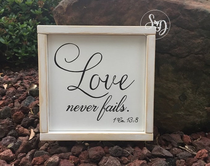 Love never fails. 1 Corinthians 13:8 Scripture Sign with wood frame - 9" x 9" x 3/4" SignsbyDenise