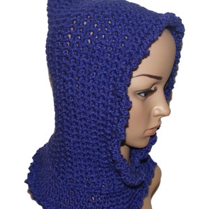 May include: A purple knitted cowl with a hood. The cowl is made with a textured stitch and has a scalloped edge.