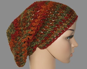 May include: A crocheted beanie in shades of green, orange, and red. The beanie is made with a loose stitch and has a slouchy fit.