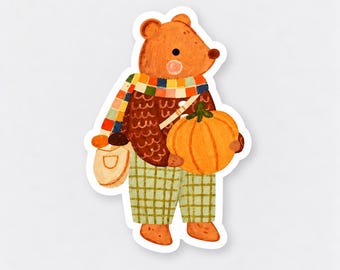 May include: A sticker illustration of an orange bear wearing a brown textured sweater, a multicolored checkered scarf, and light green plaid pants. The bear is carrying a light-colored shoulder bag and holding a large, round orange pumpkin.