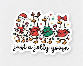 May include: A die-cut sticker featuring four white geese decorated for the holidays. The geese wear festive sweaters, a Santa hat, and a red bow, wrapped in colorful string lights. The text "just a jolly goose" is printed in black script below.