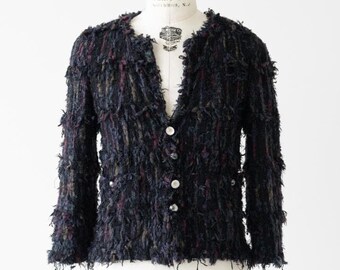 Chaqueta con flecos de tweed de CHANEL