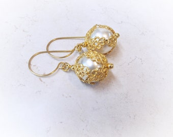 Gold and Ivory Faux Pearl Earrings Fish Hook Wires 2" Long 5/8" Wide Pearl with Gorgeous filigree bead caps