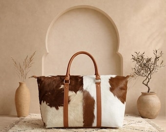 Bolsa de viaje de piel de vaca hecha a mano, con estampado de vaca estilo western.