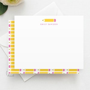 May include: White stationery card with a yellow pencil and pink eraser at the top. The name "Emily Sawson" is printed in pink below the pencil. The back of the card has a repeating pattern of yellow pencils with pink erasers.