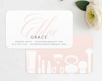 May include: Pink and white business card with the text "Chloe Grace" and contact information for a makeup artist. The back of the card features a pink background with white silhouettes of makeup brushes, lipstick, mascara, and other makeup tools.