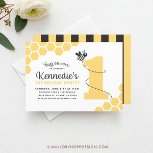 May include: A yellow and black bee-themed first birthday party invitation with a honeycomb pattern and a cartoon bee flying over the number one. The invitation reads "Buzz on over to celebrate Kennedie's 1st Bee-Day Party!" with the date, time, location, and RSVP information.