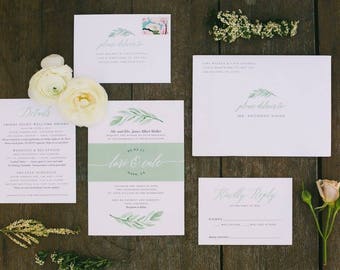 May include: Wedding invitation suite with a green and white color scheme. The invitation features a watercolor illustration of leaves and the text "Lori & Cole". The details card includes information about the wedding ceremony and reception. The RSVP card has a "Kindly Reply" heading.