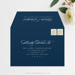 May include: A navy blue envelope with white text that reads "Kindly Deliver To" followed by an address for Mr. & Mrs. Caleb Blanche. The address includes the street name, apartment number, city, state, and zip code. Two postage stamps with floral designs are in the upper right corner.