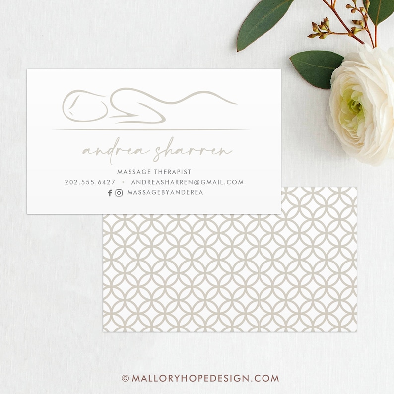 May include: White business card with a simple line drawing of a person lying down. The text "andrea sharren" is written in cursive below the drawing. The text "Massage Therapist" is written below the name, followed by a phone number and email address. The text "massagebyandrea" is written below the email address with a Facebook and Instagram icon.