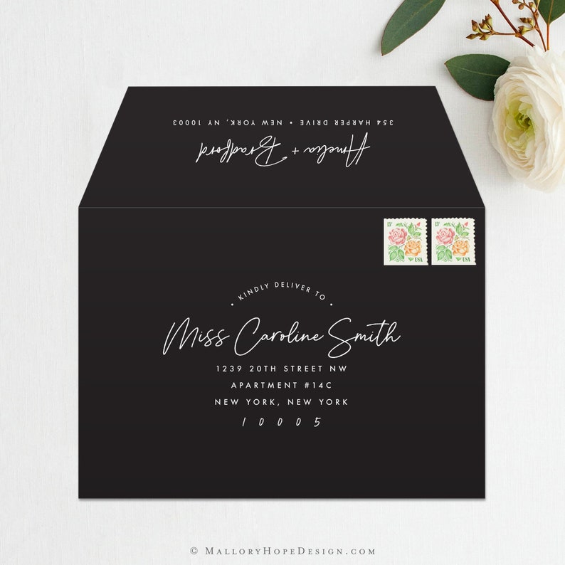 May include: Black envelope with white text. The text reads: "&bull; KINDLY DELIVER TO &bull; Miss Caroline Smith 1239 20TH STREET NW APARTMENT #14C NEW YORK, NEW YORK 10005 Amelia + Bradford 354 HARPER DRIVE NEW YORK, NY 10003".