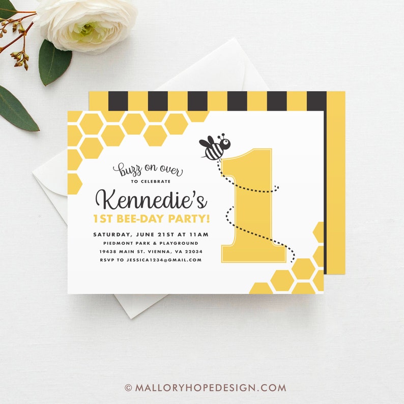 May include: A yellow and black bee-themed first birthday party invitation with a honeycomb pattern and a cartoon bee flying over the number one. The invitation text reads "Buzz on over to celebrate Kennedie's 1st Bee-Day Party!" with the date, time, location, and RSVP information.