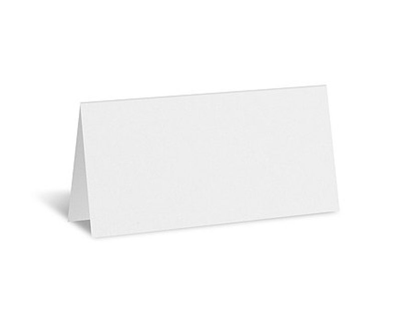 May include: A blank, white tent card, folded in half, stands upright on a white background. The card is rectangular with a smooth surface, ideal for place settings or informational displays.