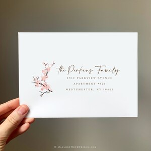 May include: A white card with a pink floral design and the text "the Perfing Family" in brown cursive font. The address is printed below: 2912 PARKVIEW AVENUE, APARTMENT #921, WESTCHESTER, NY 10461.