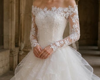 May include: A white off-the-shoulder gown featuring long sheer sleeves adorned with intricate floral lace appliqués. The bodice is fitted with matching lace detailing, transitioning into a voluminous skirt composed of layered tulle ruffles.