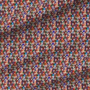 May include: A fabric textile featuring a repeating pattern of small, colourful cartoon-style characters arranged in a grid. The design includes various figures in shades of red, blue, yellow, and green against a dark background, with a ruler visible.
