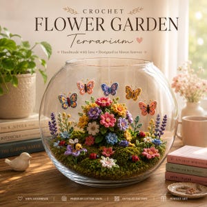 May include: A clear glass bowl terrarium containing a crochet flower garden with colorful yarn flowers, green moss, small ladybugs, a bee, and several hanging crochet butterflies. The text CROCHET FLOWER GARDEN Terrarium is visible above.