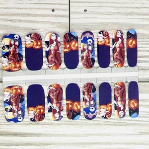 May include: A set of 10 nail wraps featuring a purple background with images of Jack Skellington and Sally from the Nightmare Before Christmas film. The images include pumpkins and a starry night sky.