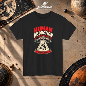 T-Shirt mit UFO-Grafik zum Thema Menschenentführung | Design eines außerirdischen Raumschiffs