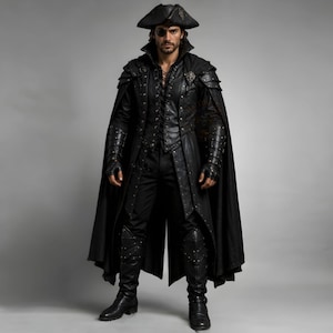 May include: A black ensemble featuring a long cape, a structured vest with lace-up front detailing, matching trousers, and tall boots. The outfit includes fingerless gloves, shoulder armor pieces, and a wide-brimmed hat with a decorative emblem.
