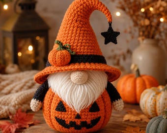 May include: A crochet gnome figurine featuring an orange pumpkin-shaped body with a black jack-o'-lantern face. The gnome wears a tall orange pointed hat with a black band, a small orange pumpkin accent, and a dangling black star charm.