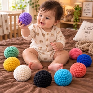 May include: A collection of ten spherical crochet balls in various solid colors including purple, mint green, yellow, cream, black, light blue, coral, dark blue, and pink, featuring a textured, knotted yarn surface and a round, uniform shape.