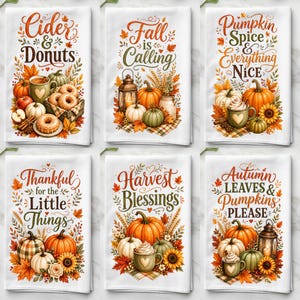 May include: A set of six white kitchen towels featuring autumn-themed illustrations and text. Designs include Cider & Donuts, Fall is Calling, Pumpkin Spice & Everything Nice, Thankful for the Little Things, Harvest Blessings, and Autumn Leaves & Pumpkins Please.