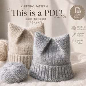 May include: A digital PDF knitting pattern featuring two cat-ear beanies, one beige and one light gray, with matching yarn balls. Text includes KNITTING PATTERN, This is a PDF!, Instant Download, Digital Pattern, Step-by-Step Instructions.