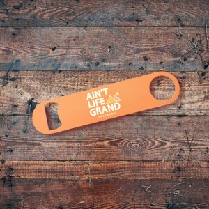 Ain&#39;t Life Grand - Colorado XL Rust colored bottle opener... Outdoor camping barware beer