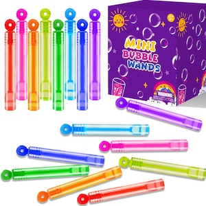 May include: A collection of multi-colored plastic bubble wands in red, pink, orange, yellow, green, blue, and purple. The wands are cylindrical with a circular loop at one end. A purple display box features the text MINI BUBBLE WANDS.