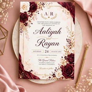 May include: A wedding invitation card featuring deep burgundy and cream roses, gold accents, and elegant typography. The text reads: Aaliyah and Rayan, Saturday 24 August 2025, at 5 o'clock in the evening, The Grand Palace, 123 Rose Garden Lane, San Diego, California.