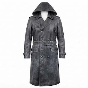 May include: A charcoal grey, distressed leather trench coat featuring a double-breasted front with dark buttons, a matching waist belt with a buckle, two large flap pockets, shoulder epaulettes, adjustable sleeve cuffs, and a detachable hood.