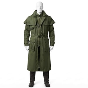 May include: An olive green trench coat featuring a capelet overlay, a high collar with a buckle strap, and a waist belt. The coat includes two large front flap pockets, shoulder epaulets, and long sleeves with adjustable cuffs, worn over dark trousers.