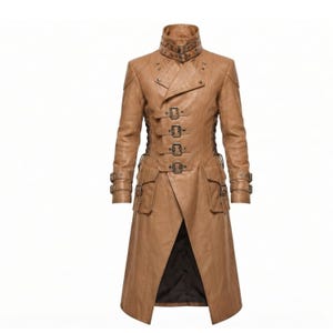 May include: A tan long coat featuring a high collar with a buckle strap, a front closure with four horizontal buckle straps, two side pockets with flaps, and buckle straps on each sleeve cuff. The coat has a structured design with visible seams.